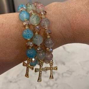 They’re 4 different colors Beaded Bracelet with Gold Cross Charm